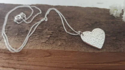 Floral pattern silver heart pendant